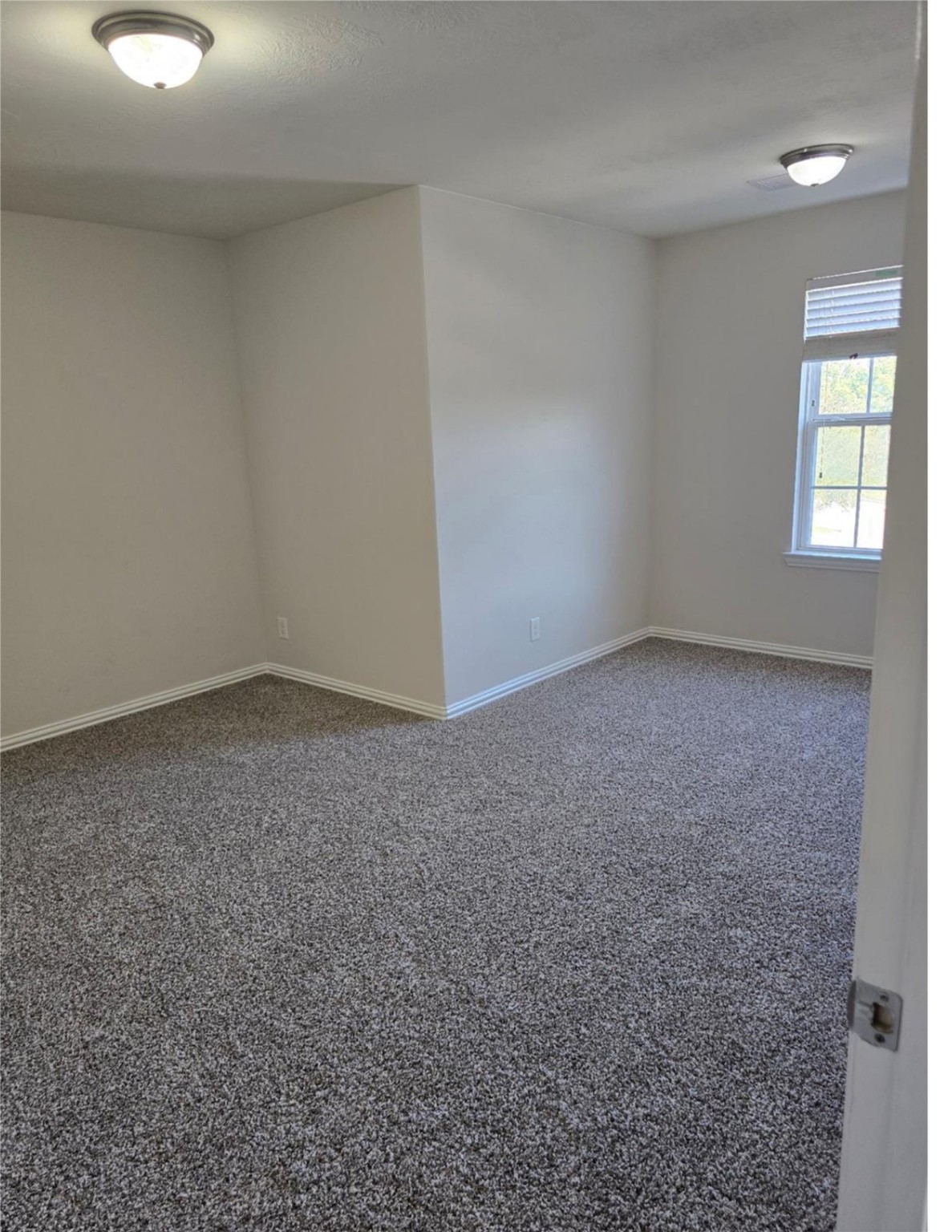 9702 Layton Ridge Drive Humble, TX 77396 - Photo 7 of 21 an empty room with a window