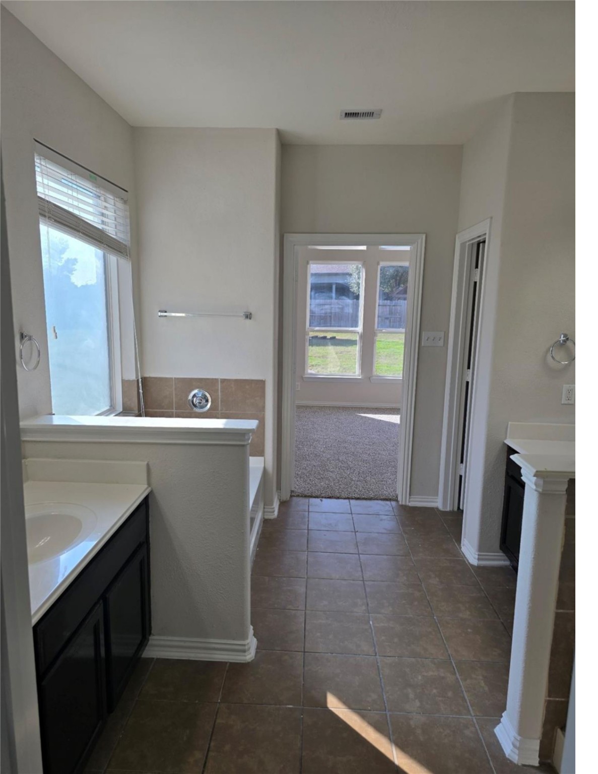 9702 Layton Ridge Drive Humble, TX 77396 - Photo 8 of 21 a view of a kitchen with fridge and front door