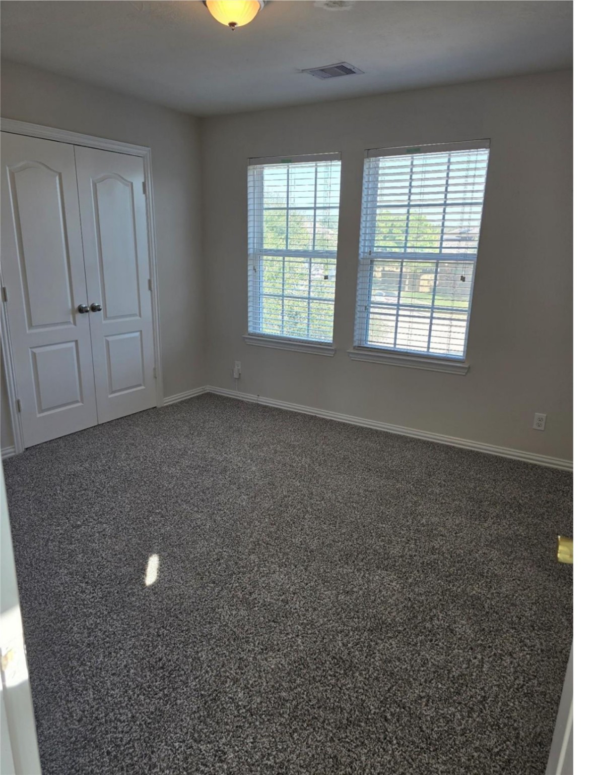 9702 Layton Ridge Drive Humble, TX 77396 - Photo 9 of 21 an empty room with windows and entrance