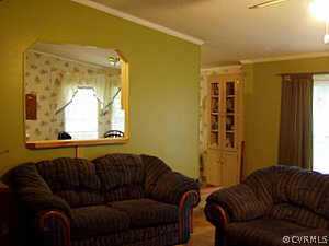 10120 Reed Rock Road Amelia Court House, VA 23002 - Photo 3 of 6 a living room with a couch and a window