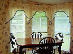 10120 Reed Rock Road Amelia Court House, VA 23002 - Photo 4 of 6 a view of a dining room and chairs