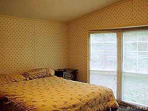 10120 Reed Rock Road Amelia Court House, VA 23002 - Photo 6 of 6 a bedroom with a bed and a window