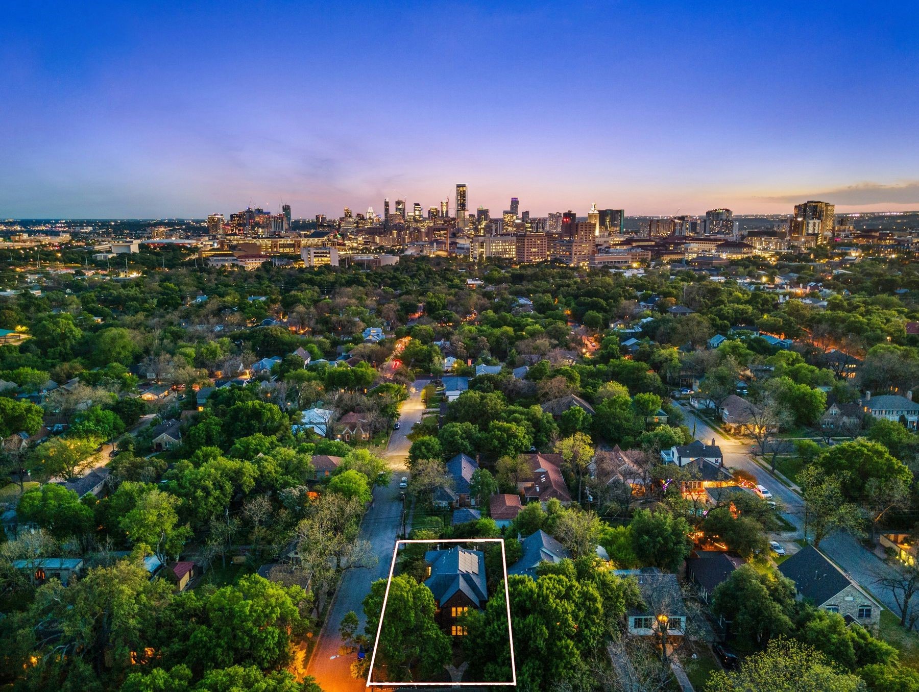 609 Texas Austin, TX 78705 - Photo 2 of 18 The upstairs unit has a tree top view of downtown Austin from the porch.