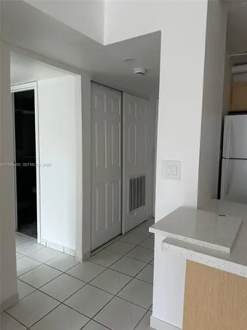 a view of a kitchen from the hallway