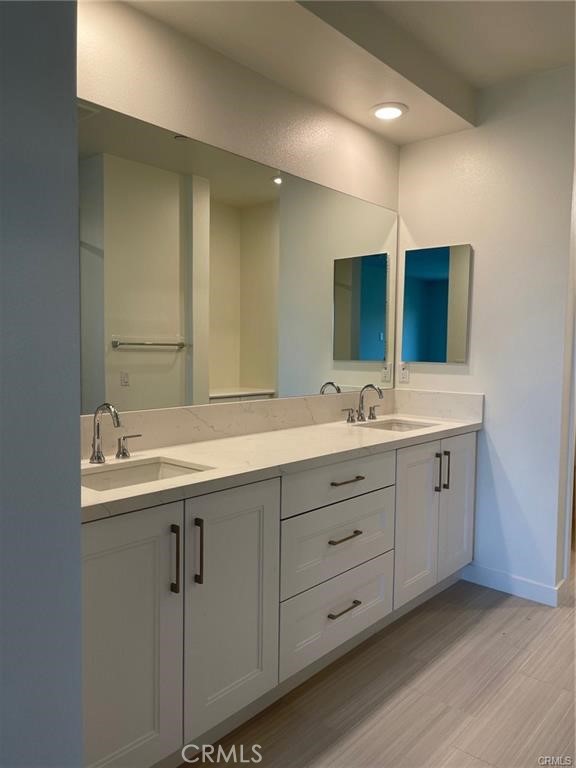 3326 Doheny Way Dana Point, CA 92629 - Photo 14 of 46 a bathroom with double sink and mirror