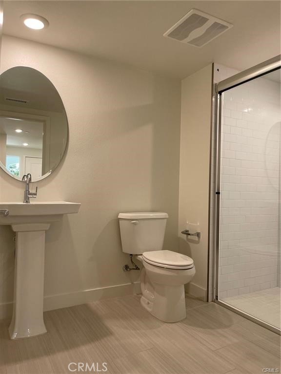 3326 Doheny Way Dana Point, CA 92629 - Photo 23 of 46 a bathroom with a toilet sink and a mirror