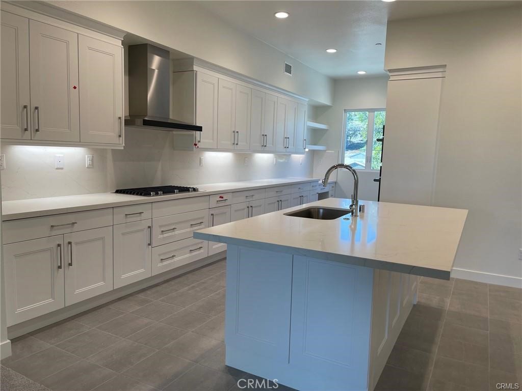 3326 Doheny Way Dana Point, CA 92629 - Photo 7 of 46 a kitchen with cabinets appliances a sink and a counter top space