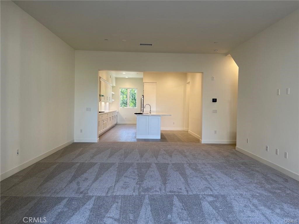 3326 Doheny Way Dana Point, CA 92629 - Photo 10 of 46 an empty room with windows and cabinet