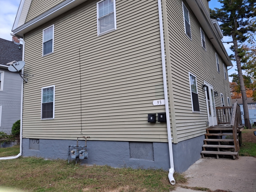 a view of a house with a yard and garage