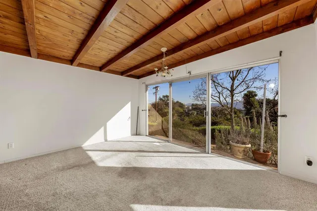 a view of a room with wooden walls
