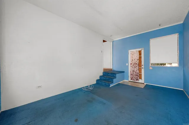 an empty room with staircase