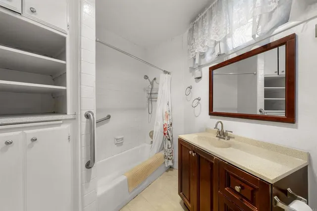 a bathroom with a sink a vanity and a mirror