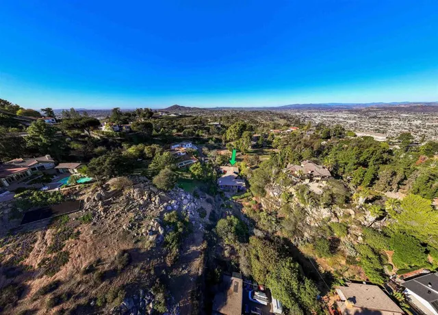 a view of a city with green space