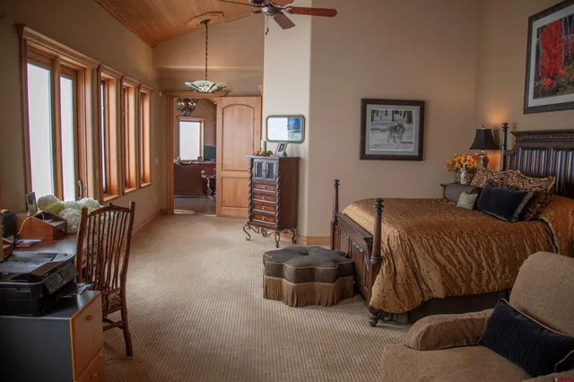 a bedroom with furniture and a bed