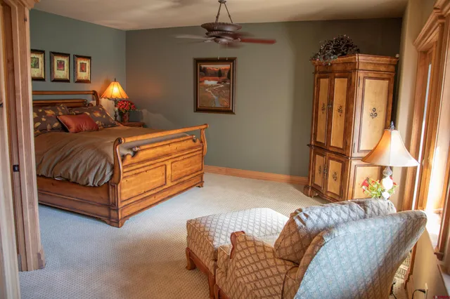 a bedroom with bed window and couch