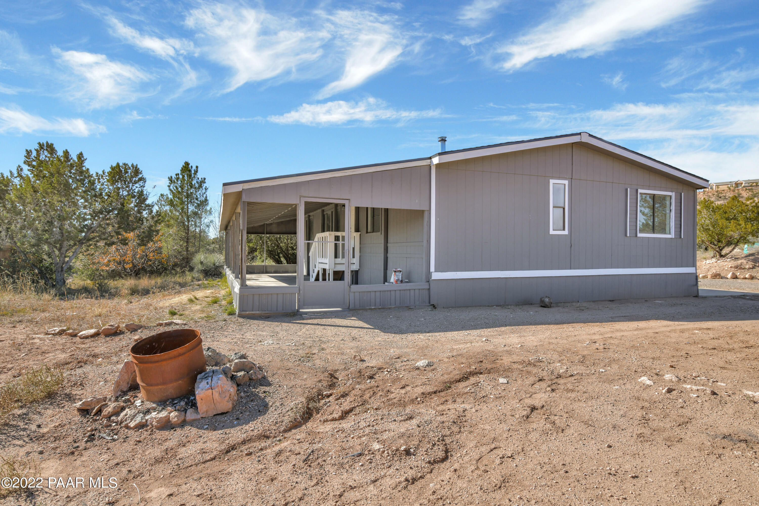 4515 Quail Hollow Road Rimrock, AZ 86335 - Photo 27 of 33 a backyard of a house with seating space