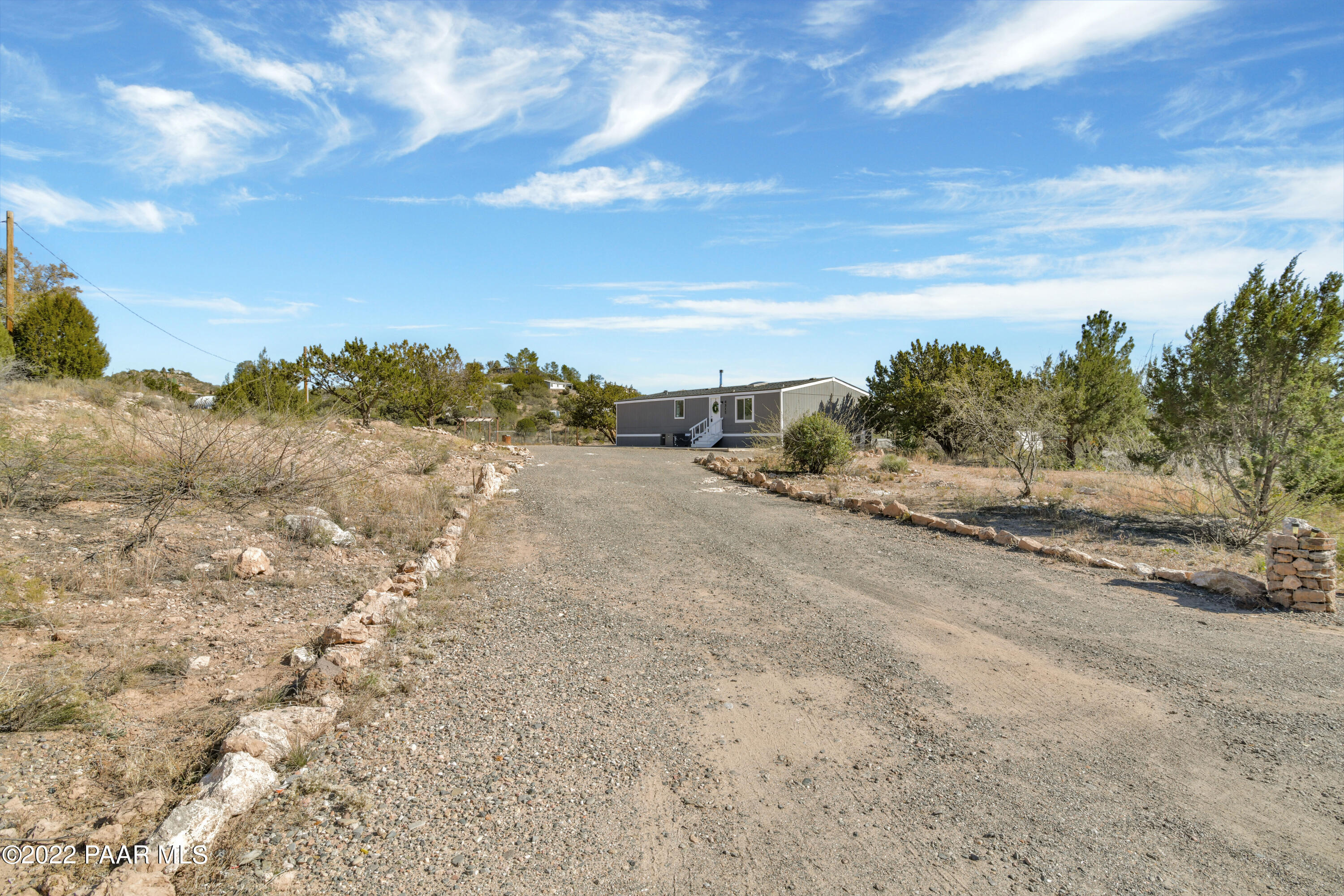 4515 Quail Hollow Road Rimrock, AZ 86335 - Photo 29 of 33 a view of a dry yard with wooden fence