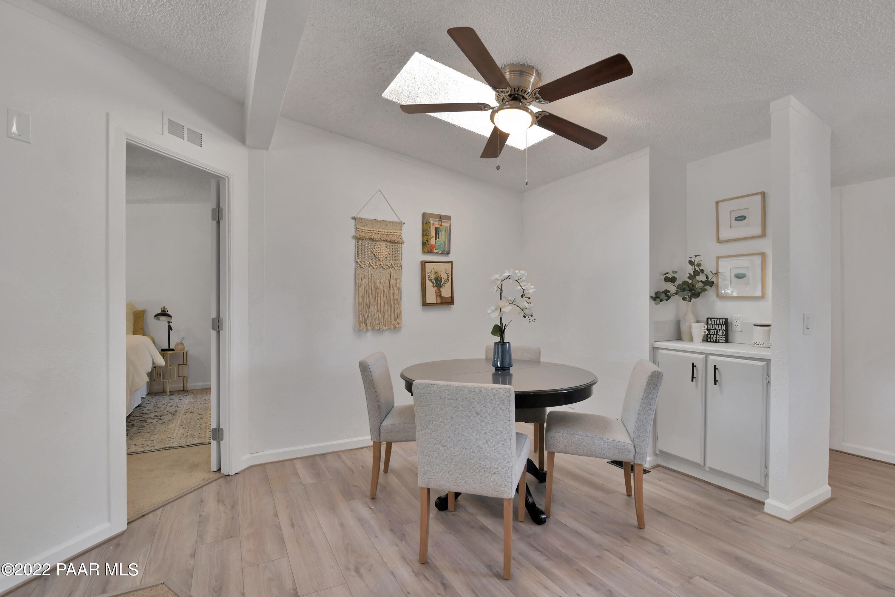 4515 Quail Hollow Road Rimrock, AZ 86335 - Photo 7 of 33 a view of a a dining room with furniture wooden floor and a chandelier