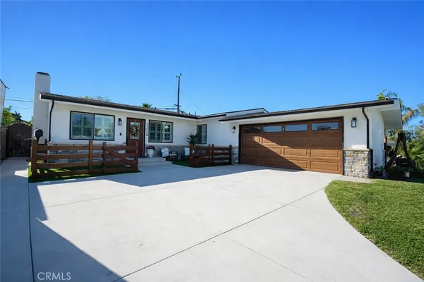 a view of house with outdoor space and porch