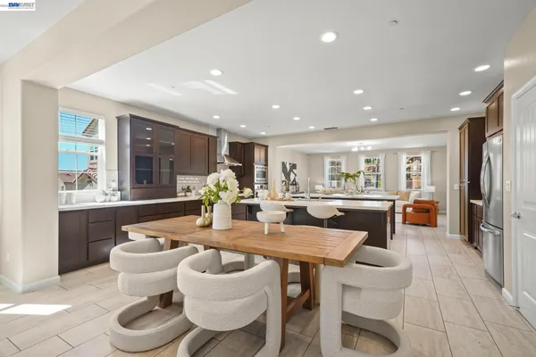 a spacious bedroom with a bed and a couch