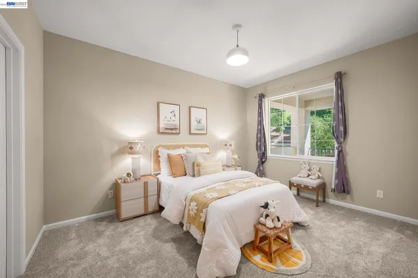 a bedroom with a bed and a view of bathroom