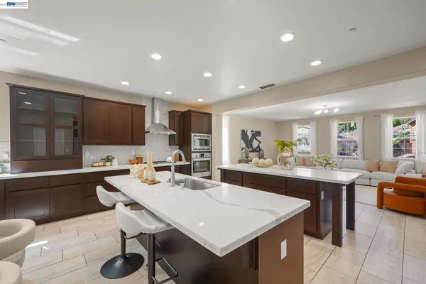 a bathroom with a sink a toilet and shower a mirror