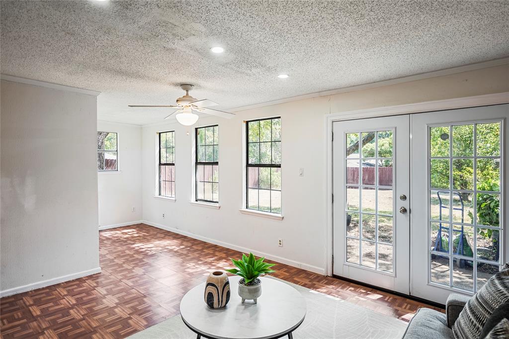 1203 Springbrook Circle DeSoto, TX 75115 - Photo 22 of 27 Living area with crown molding, french doors, a textured ceiling, ceiling fan, and recessed lighting