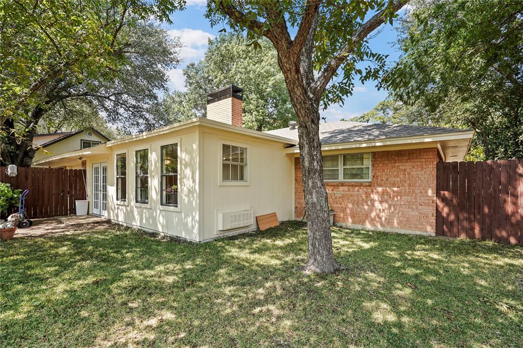 1203 Springbrook Circle DeSoto, TX 75115 - Photo 25 of 27 Rear view of property with a chimney and brick siding
