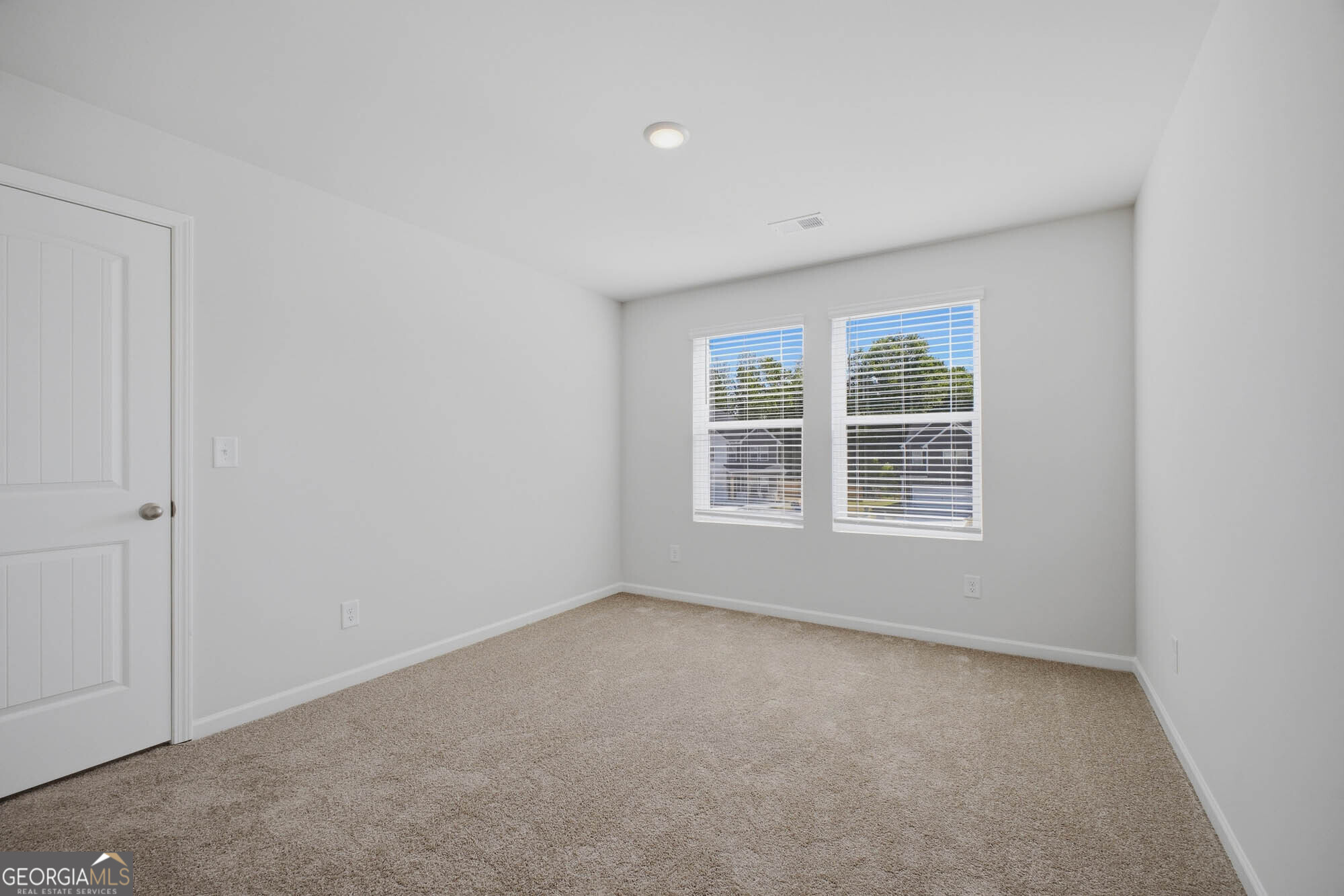 309 Rusty Plow Lane Perry, GA 31069 - Photo 8 of 34 an empty room with a window