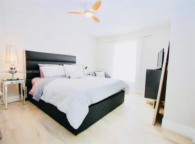 a bedroom with a bed and dresser