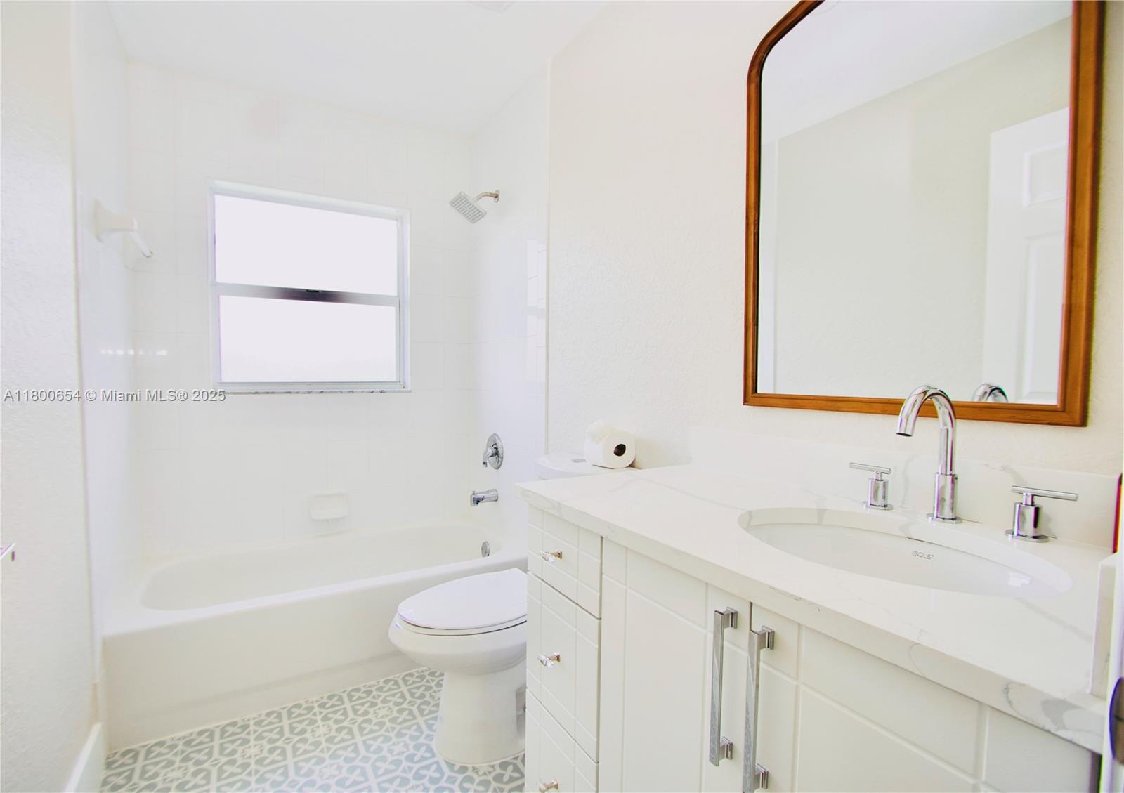 244 Northwest 6th Avenue, Unit 244 Delray Beach, FL 33444 - Photo 28 of 35 a bathroom with a sink a toilet and a bathtub