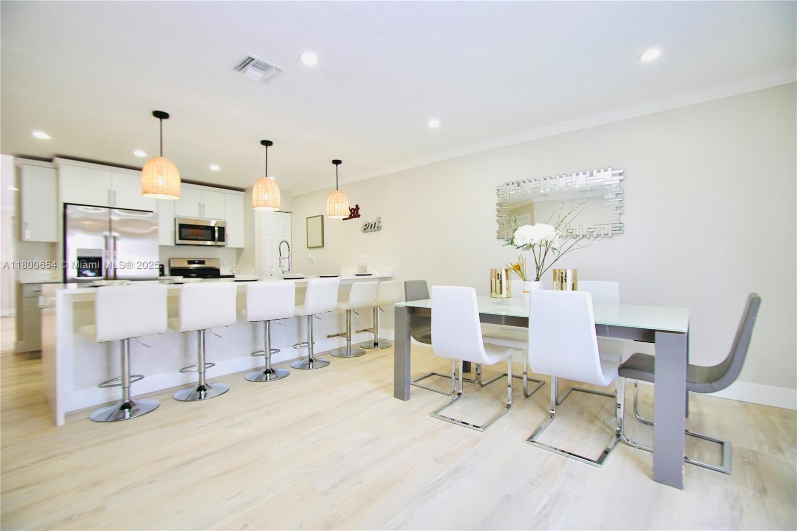 244 Northwest 6th Avenue, Unit 244 Delray Beach, FL 33444 - Photo 5 of 35 a living room with furniture and kitchen view