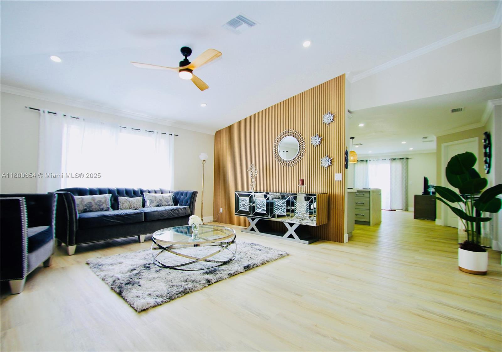 244 Northwest 6th Avenue, Unit 244 Delray Beach, FL 33444 - Photo 7 of 35 a living room with furniture and wooden floor