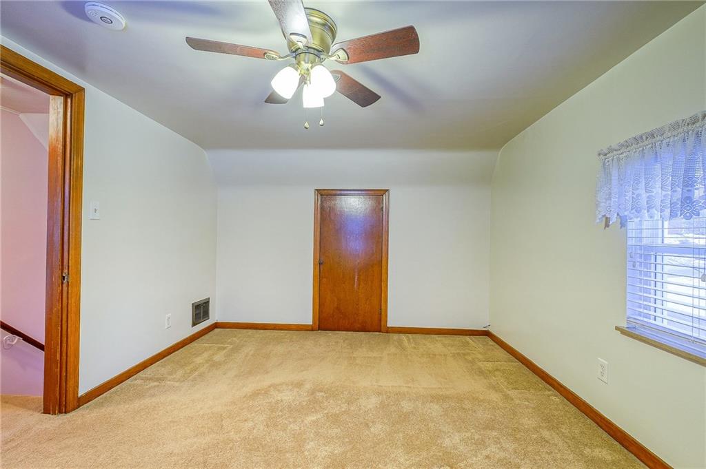 33 Kennedy Lane McKees Rocks, PA 15136 - Photo 11 of 19 an empty room with windows and fan