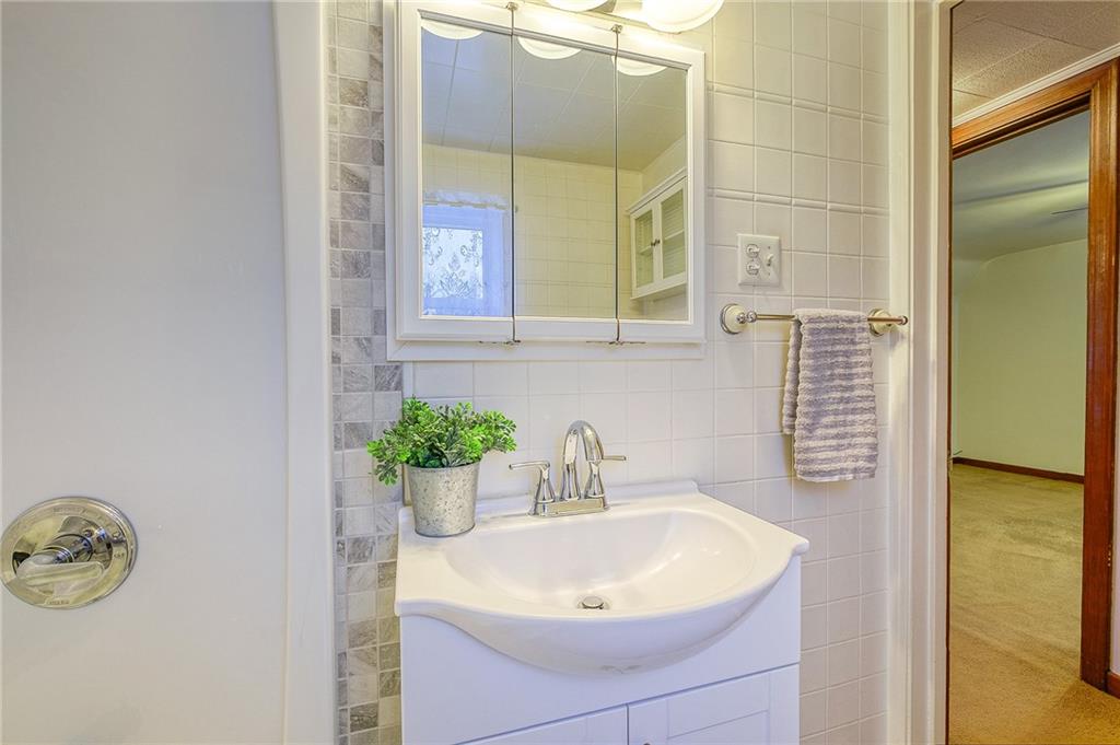 33 Kennedy Lane McKees Rocks, PA 15136 - Photo 15 of 19 a bathroom with a sink and a mirror