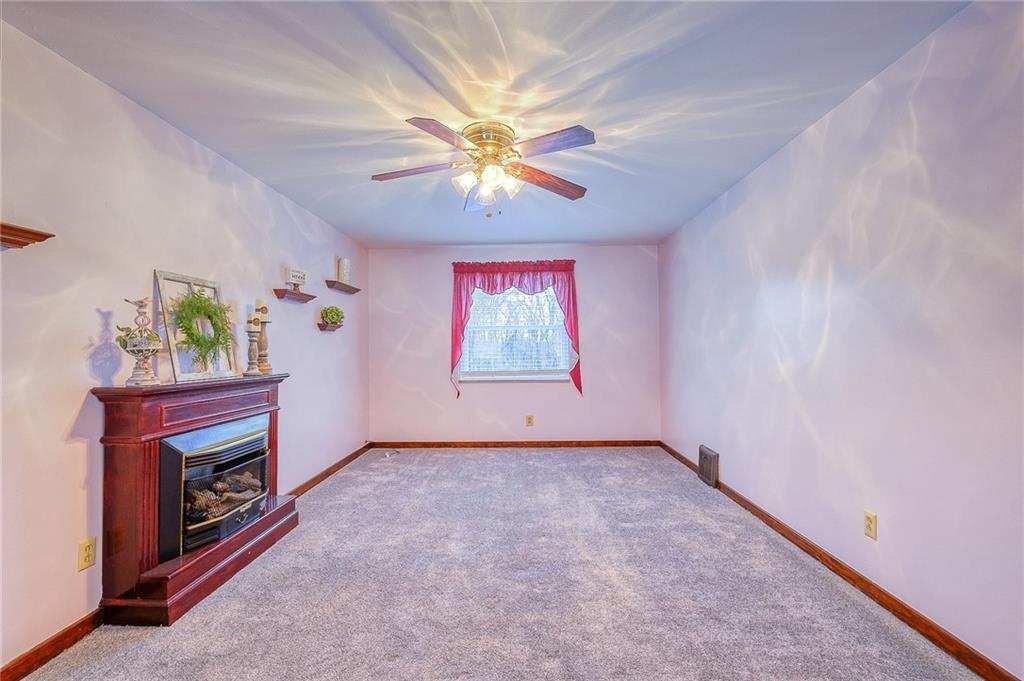 33 Kennedy Lane McKees Rocks, PA 15136 - Photo 4 of 19 an empty room with windows and fireplace