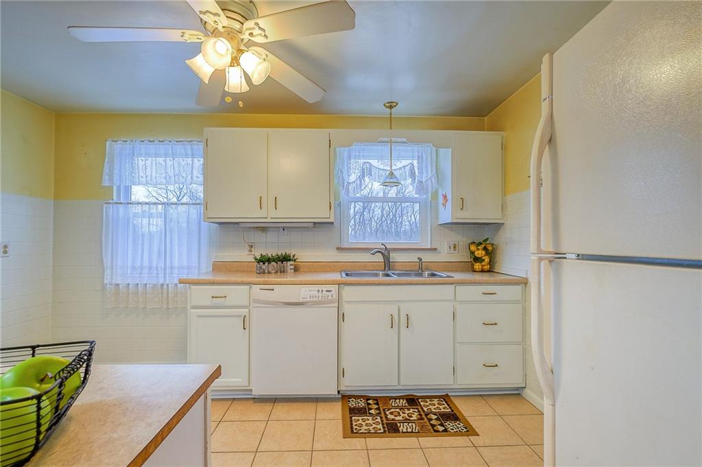 33 Kennedy Lane McKees Rocks, PA 15136 - Photo 8 of 19 a kitchen with stainless steel appliances a stove a sink and a refrigerator