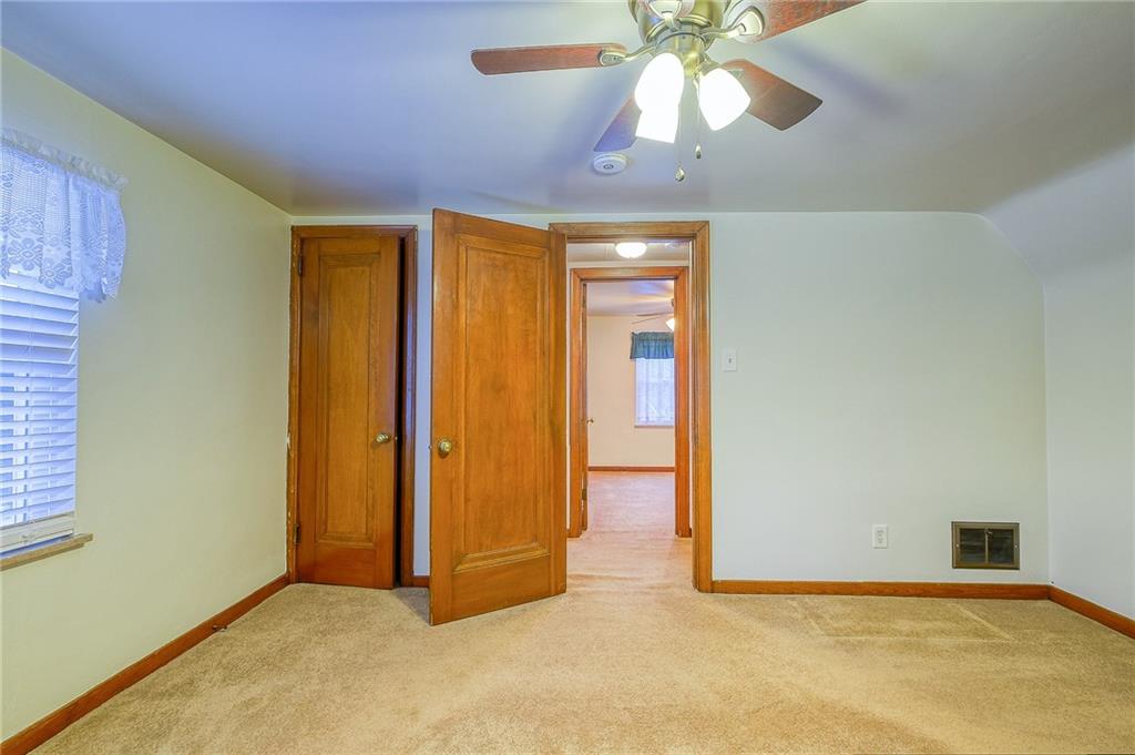 33 Kennedy Lane McKees Rocks, PA 15136 - Photo 10 of 19 an empty room with closet and chandelier fan