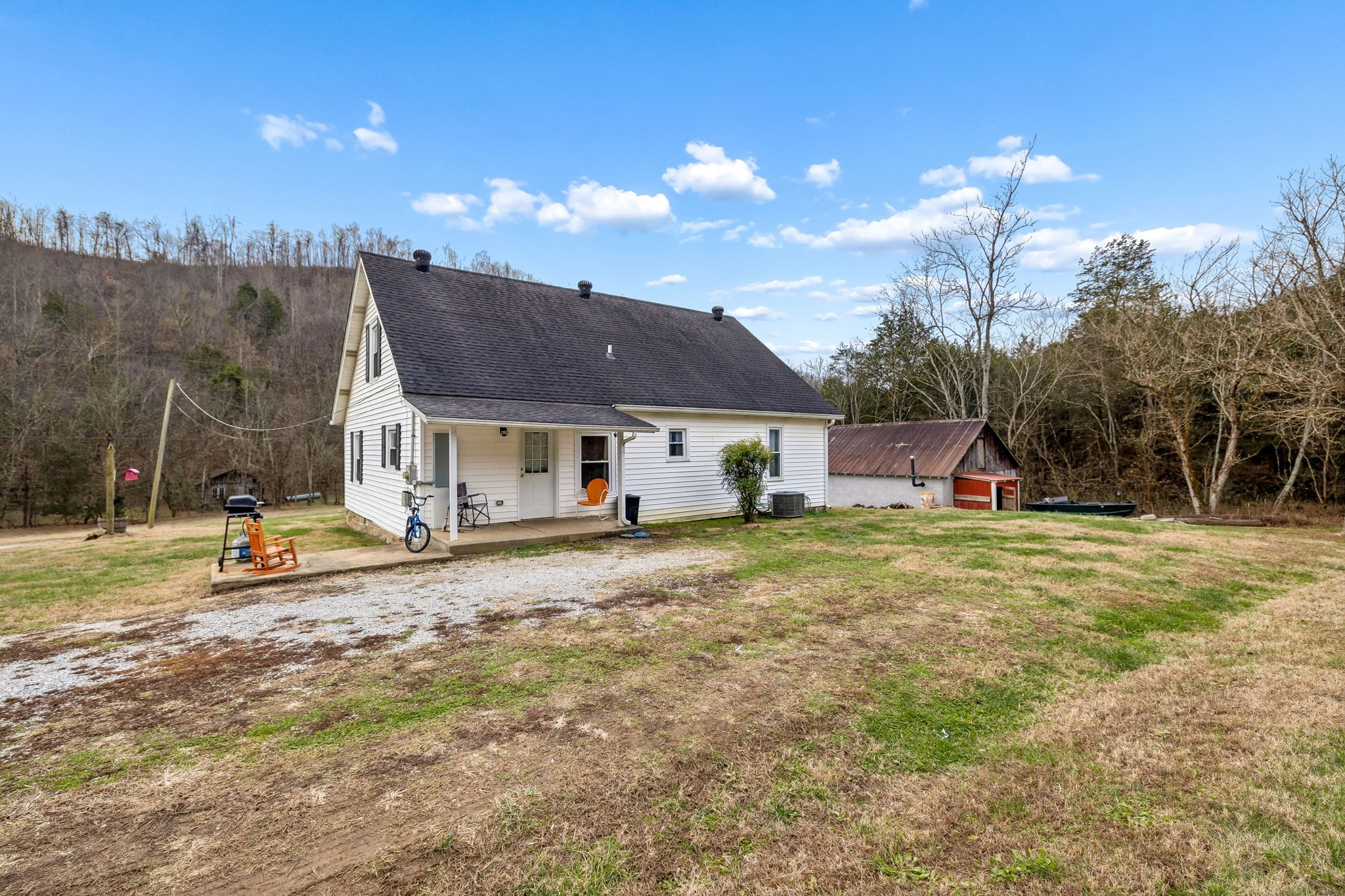 147 Sloan Branch Road Pleasant Shade, TN 37145 - Photo 35 of 53 a view of a house with a yard and sitting area