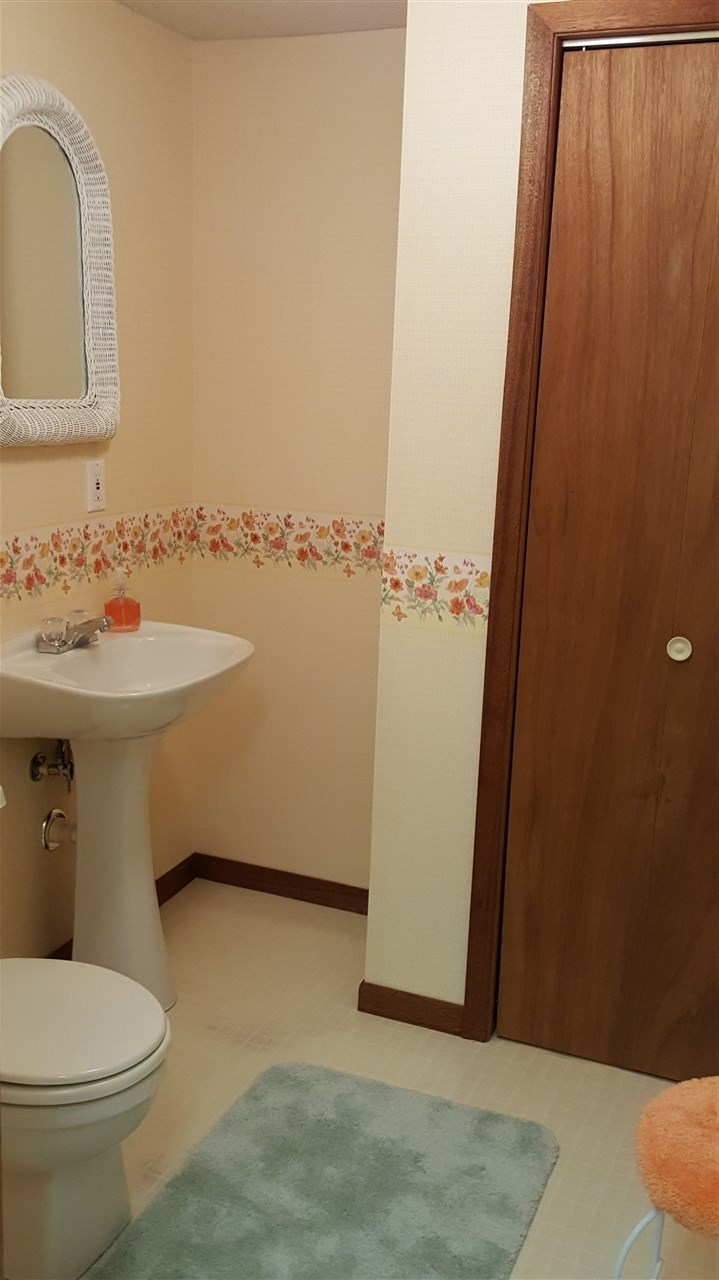414 Rebecca Road Belvidere, IL 61008 - Photo 16 of 22 a bathroom with a sink and mirror with toilet