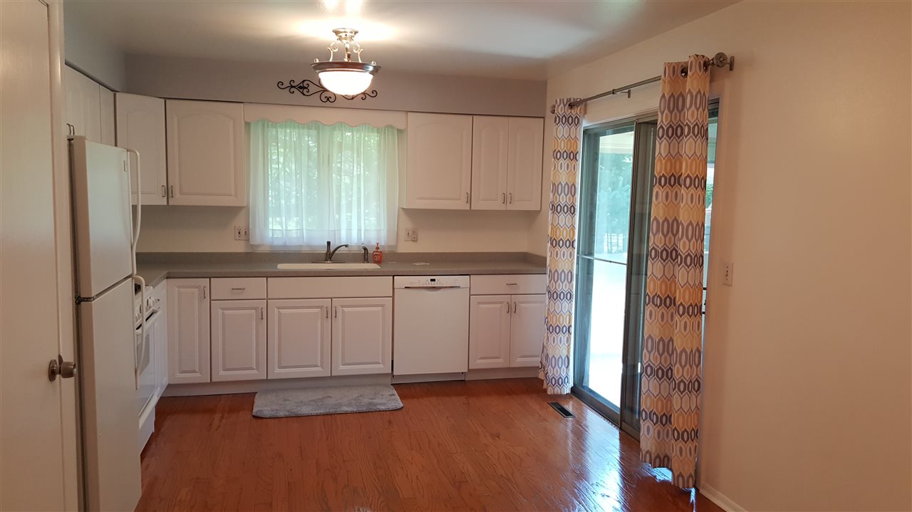 414 Rebecca Road Belvidere, IL 61008 - Photo 3 of 22 a kitchen with white cabinets and window