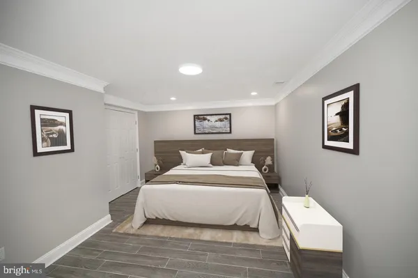 a bedroom with a large bed and a lamp