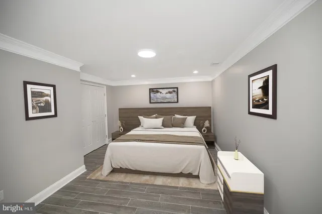 a bedroom with a large bed and a lamp