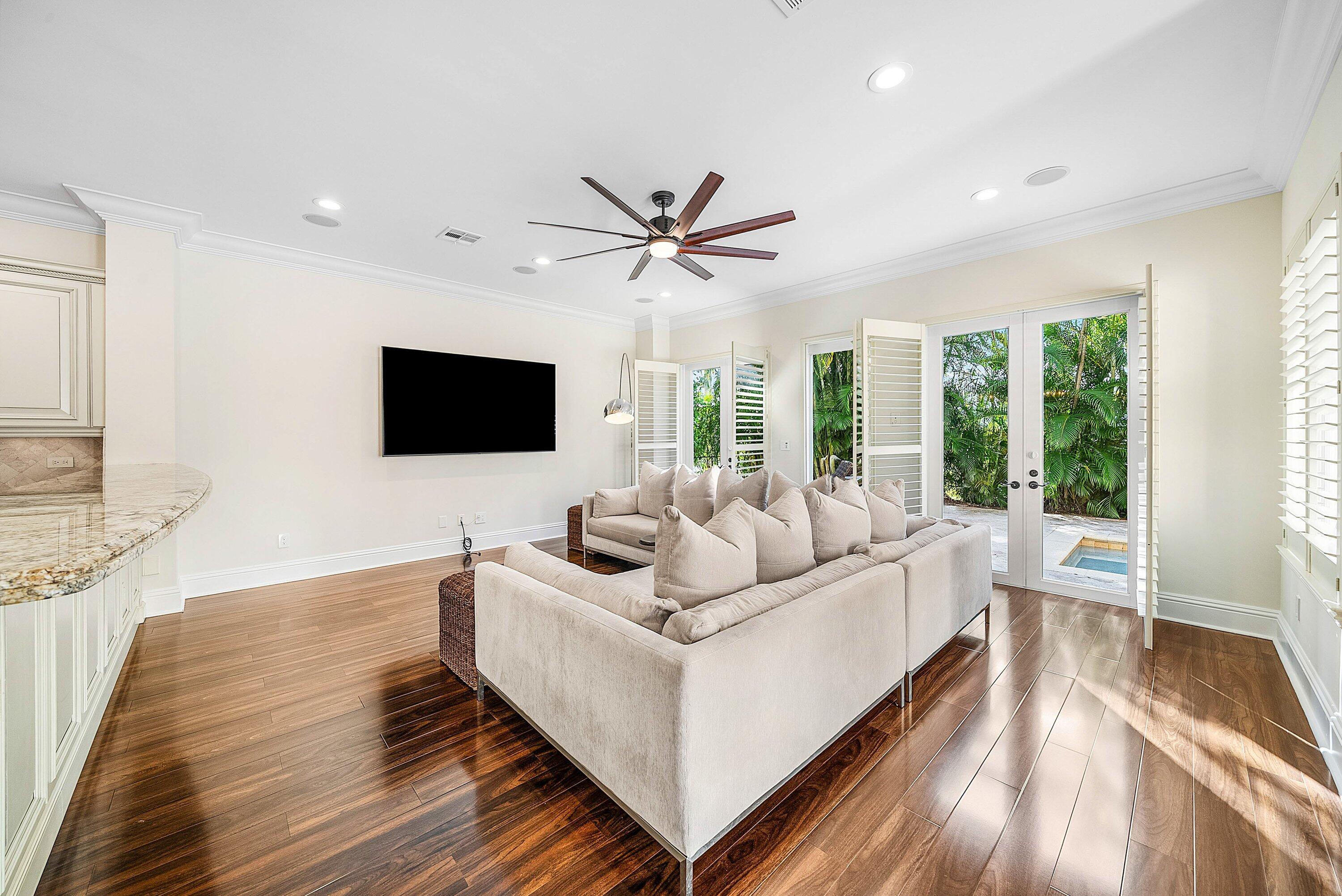 398 Northeast 7th Street Boca Raton, FL 33432 - Photo 13 of 74 a living room with furniture and a flat screen tv