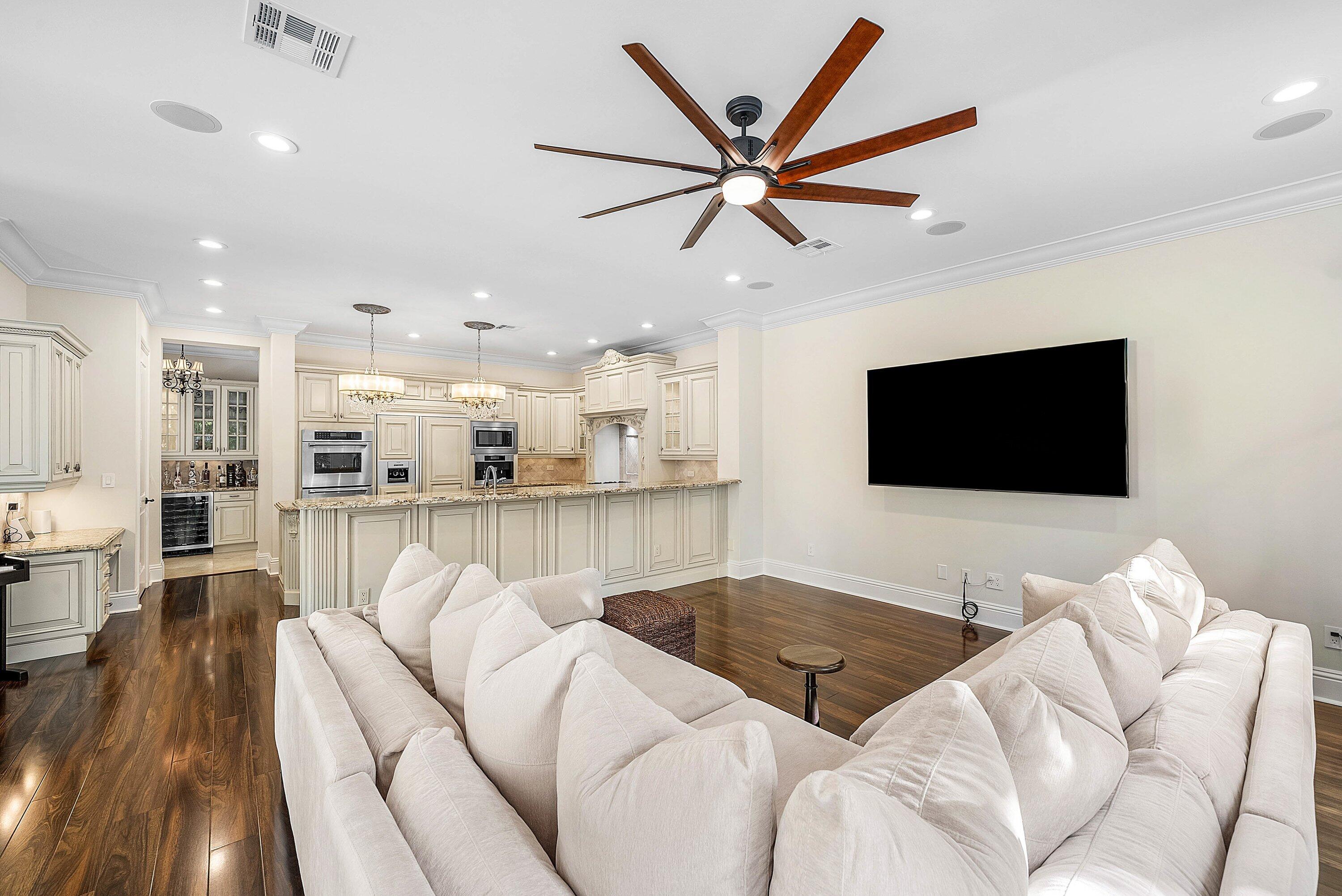 398 Northeast 7th Street Boca Raton, FL 33432 - Photo 15 of 74 a living room with furniture and a flat screen tv