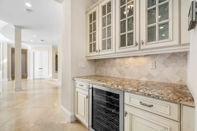 a bedroom with a bed and dresser with mirror