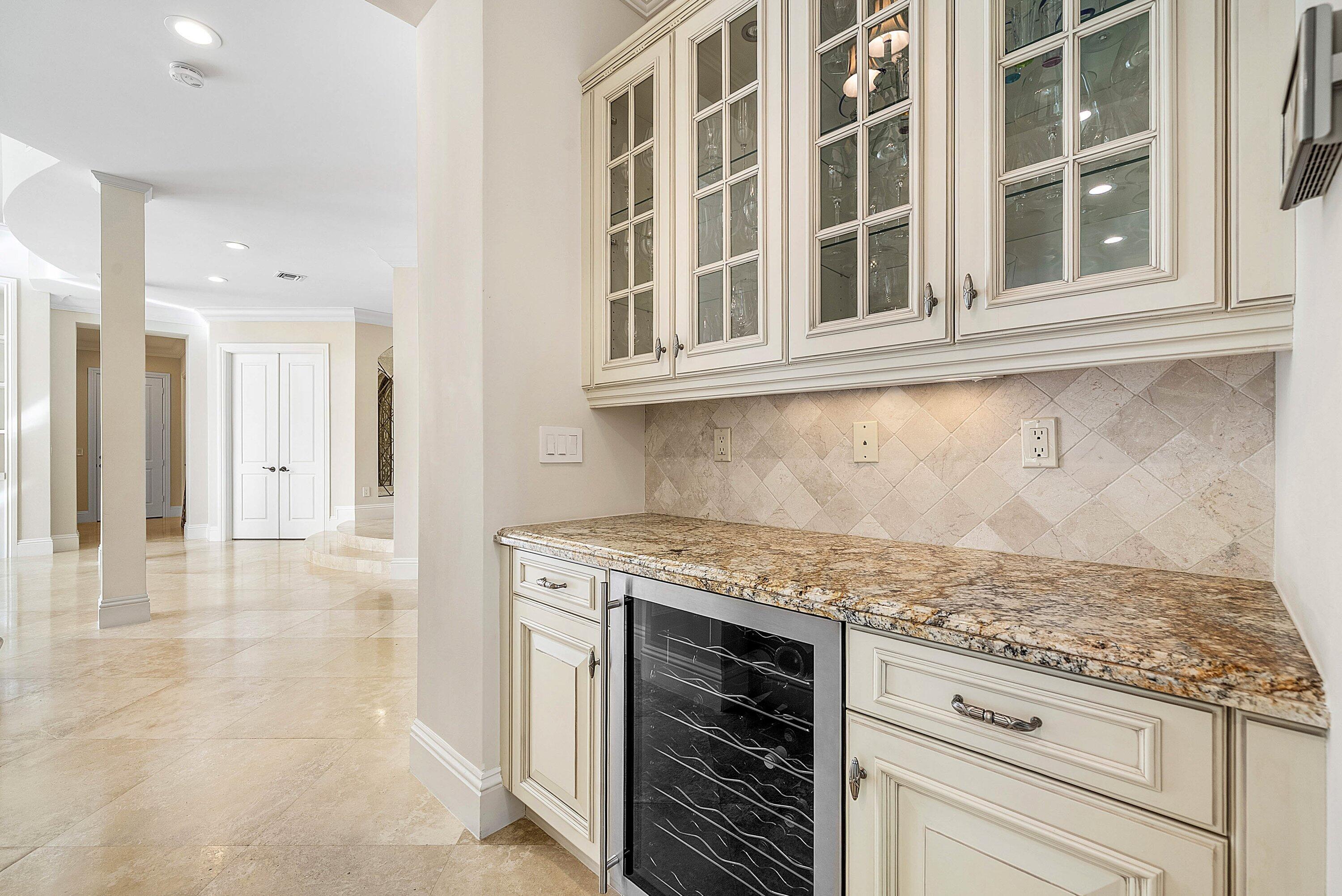 398 Northeast 7th Street Boca Raton, FL 33432 - Photo 24 of 74 a kitchen with a stove and cabinets