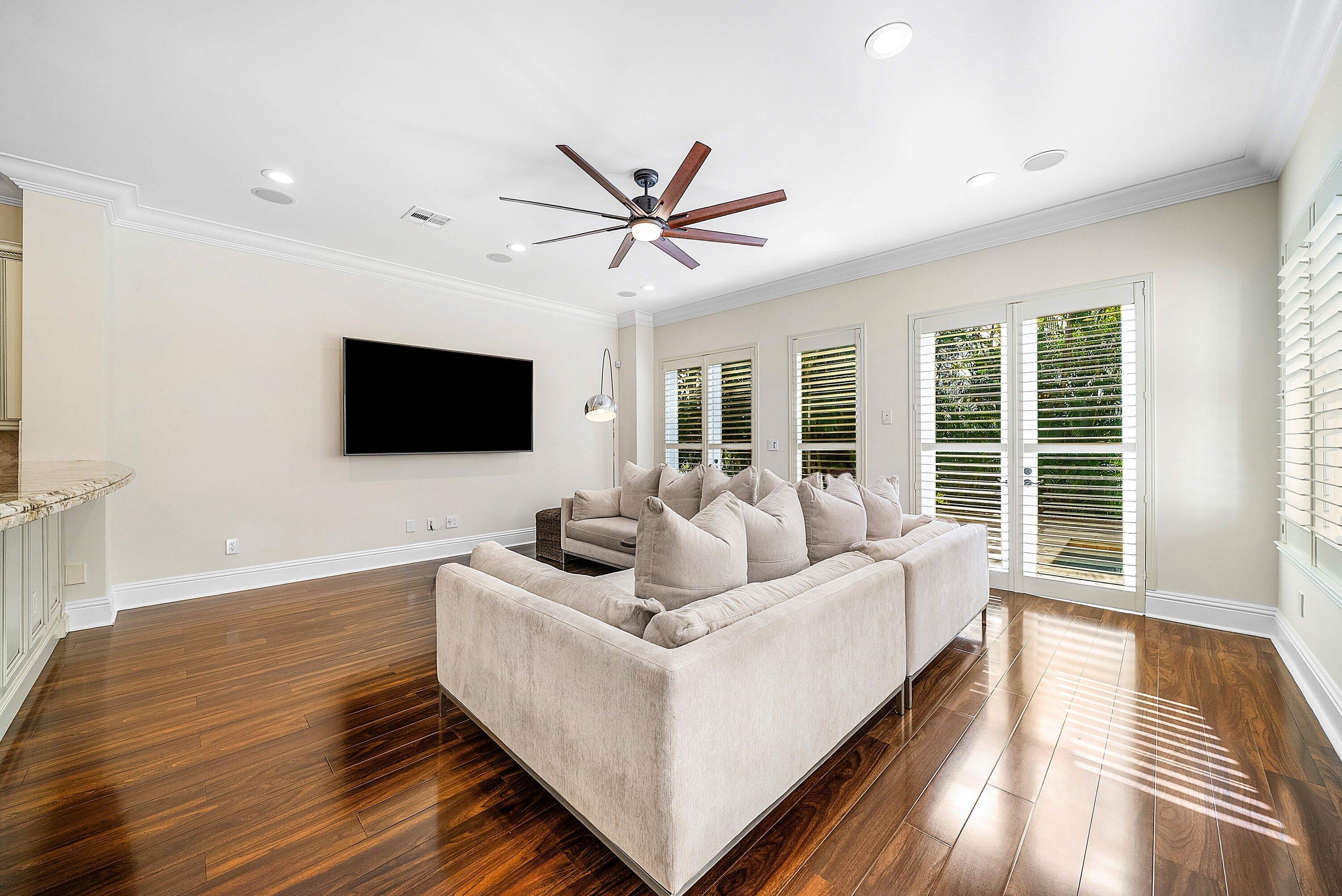 398 Northeast 7th Street Boca Raton, FL 33432 - Photo 27 of 74 a living room with furniture and a flat screen tv