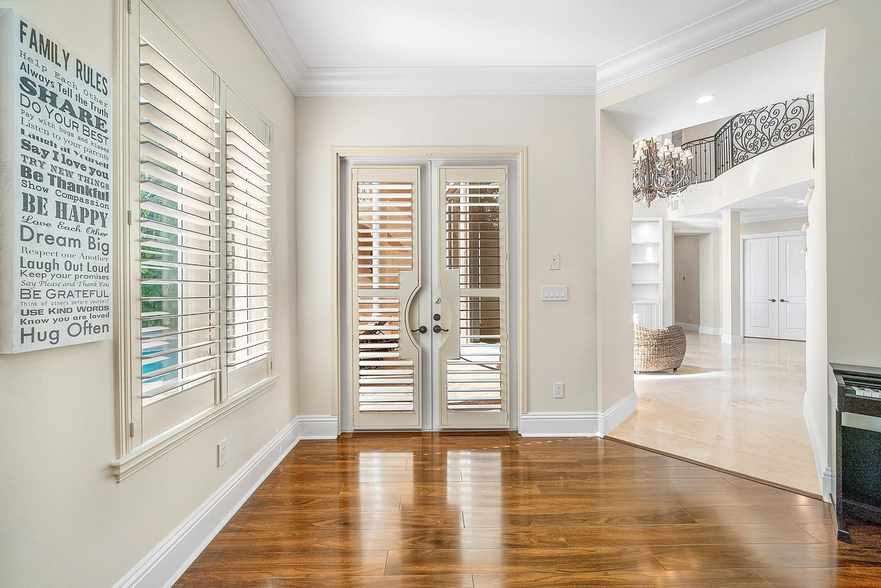 398 Northeast 7th Street Boca Raton, FL 33432 - Photo 29 of 74 a view of an empty room with wooden floor and a window