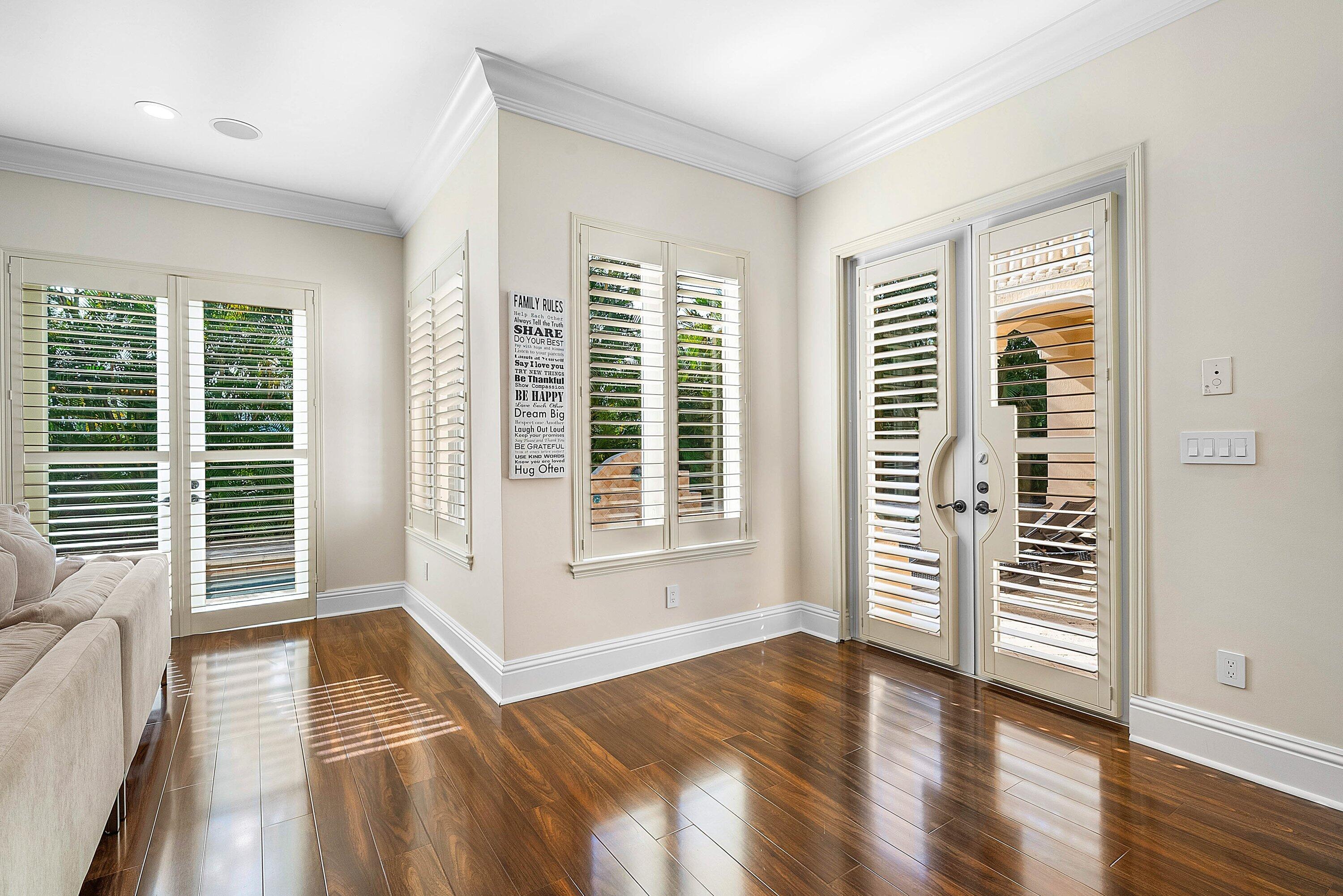 398 Northeast 7th Street Boca Raton, FL 33432 - Photo 31 of 74 an empty room with wooden floor and windows